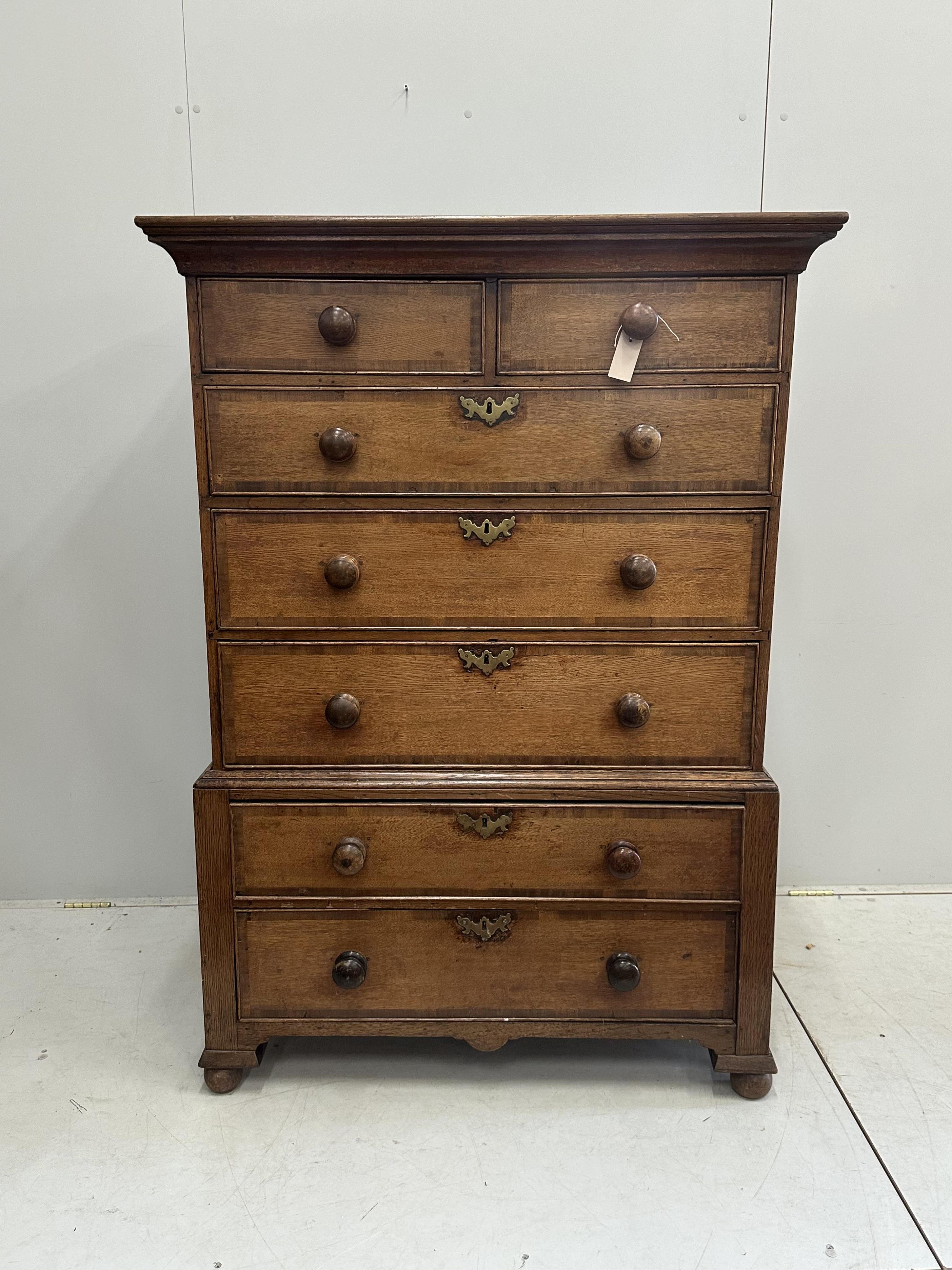 A George IV banded oak chest on stand, width 103cm, depth 56cm, height 146cm (altered). Condition - fair